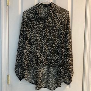 Sheer button up blouse.